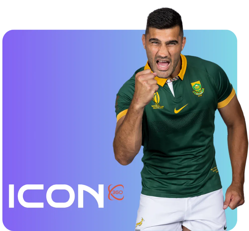 a man sitting by his desk drinking a cup of coffee with a laptop in front of him